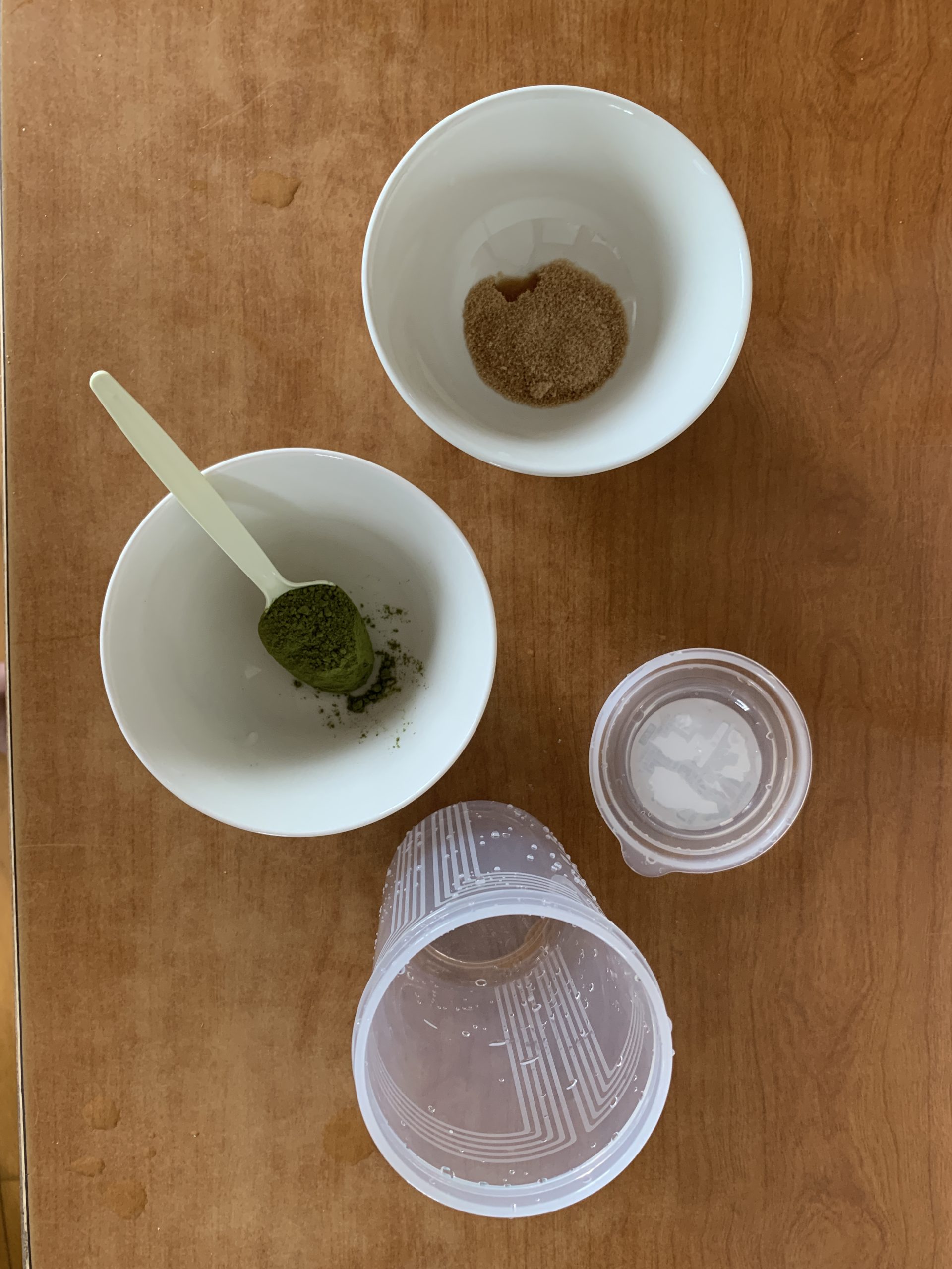 Adding matcha powder and sugar to shaker